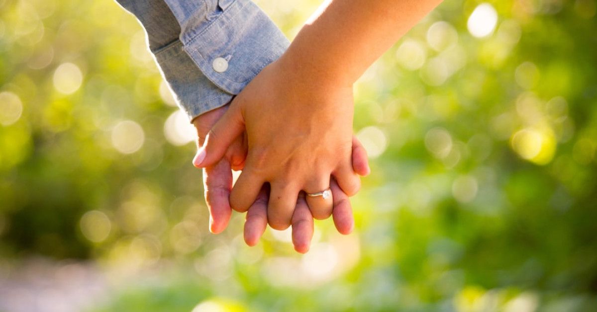 Lesbian couple embracing, accompanied by inspirational love quotes.