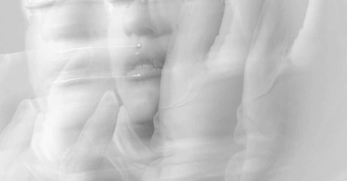 "Grey's Anatomy romantic quote overlay hearts background."